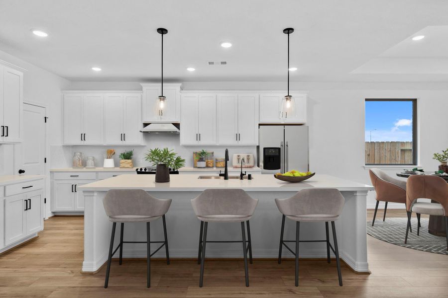 Kitchen featuring the AW Harmony Collection with classic painted white cabinetry, light countertops, and a modern tile backsplash where rustic style meets elegance.