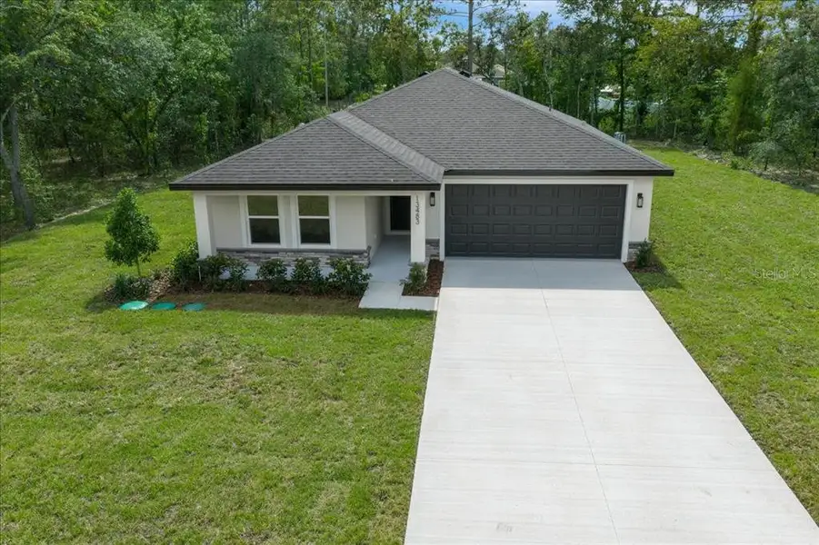 Front exterior of a new home in , Brooksville, FL, highlighting curb appeal (Image 31). Front exterior of a new home in , Brooksville, FL, highlighting curb appeal (Image 31).