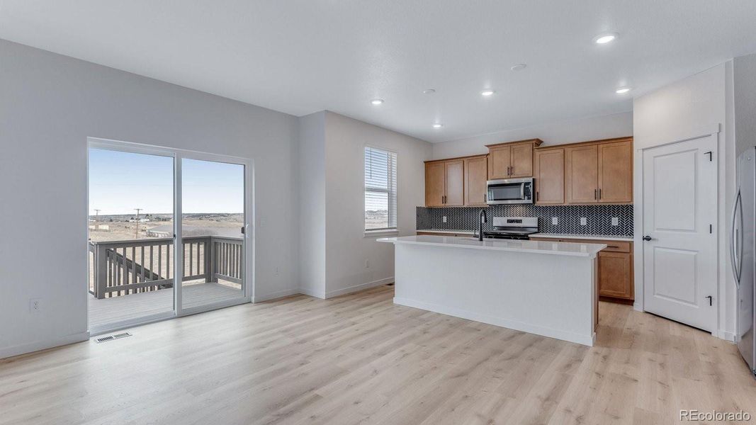 Furnished interior view inside a new home in Trails at Crowfoot, Parker (Image 10).