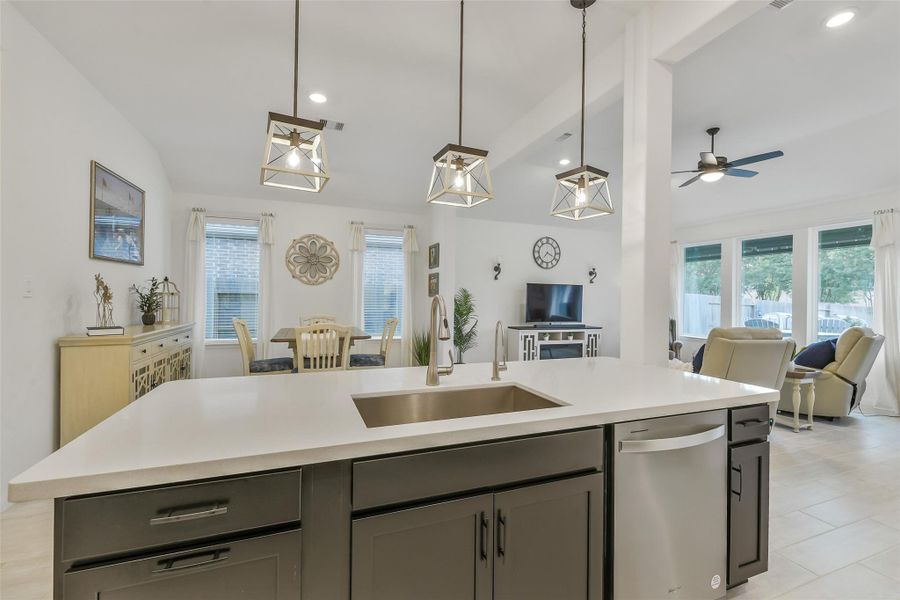 A single bowl stainless steel sink makes washing up or prepping produce simple and easy. The beautiful white quartz will complement any decor!