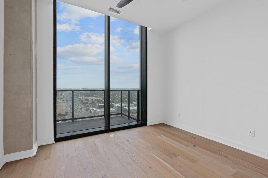 The second bedroom features ample space and natural light.