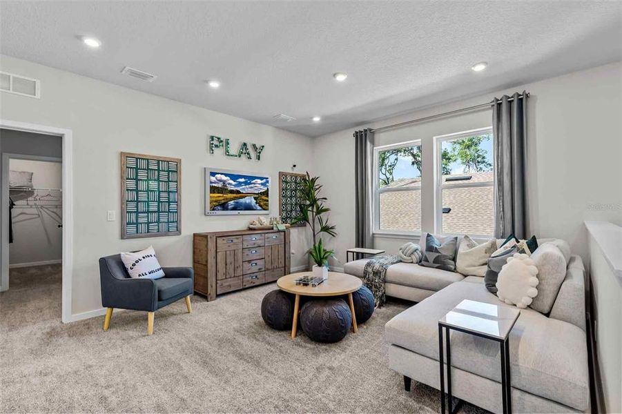 Furnished interior view inside a new home in The Cypress Series at Reserve East, Flagler Beach (Image 27).