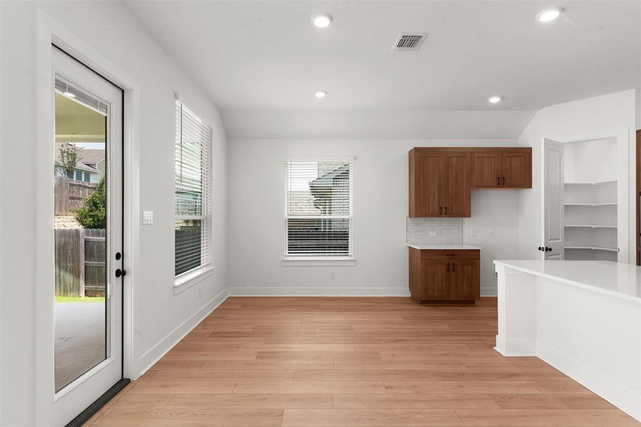 Spacious interior featuring wood-finish flooring and recessed lighting Spacious interior featuring wood-finish flooring and recessed lighting