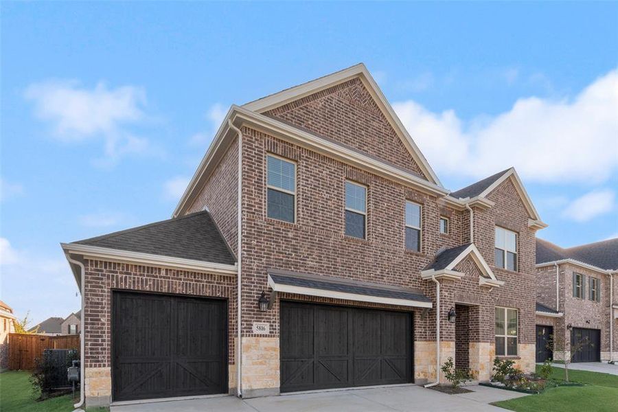 Front exterior of a new home in Sutton Fields, Celina, TX, highlighting curb appeal (Image 18).