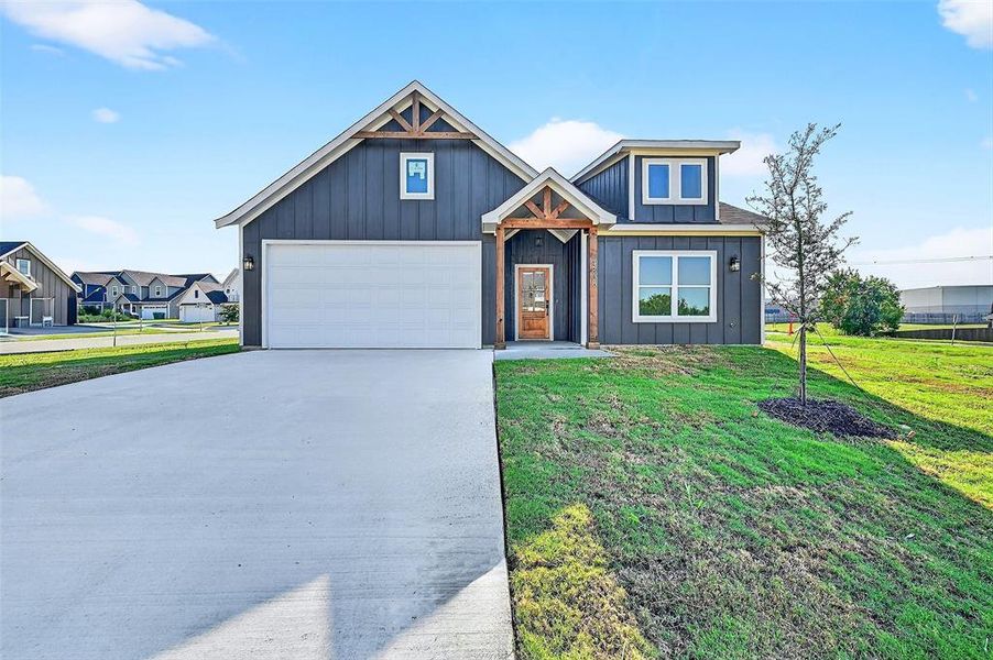 Front exterior of a new home in , Sherman, TX, highlighting curb appeal (Image 1).