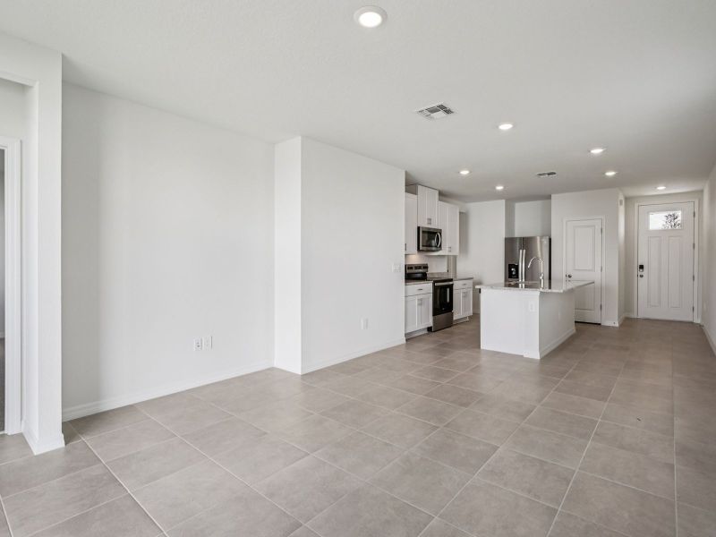 Spacious, unfurnished interior of a new home in The Grove at Stuart Crossing - Premier Series, Bartow (Image 9).