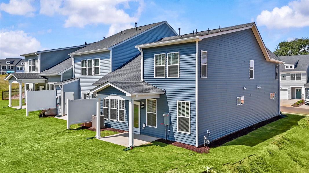 Exceptional outdoor living begins with a covered back porch in this thoughtfully designed home