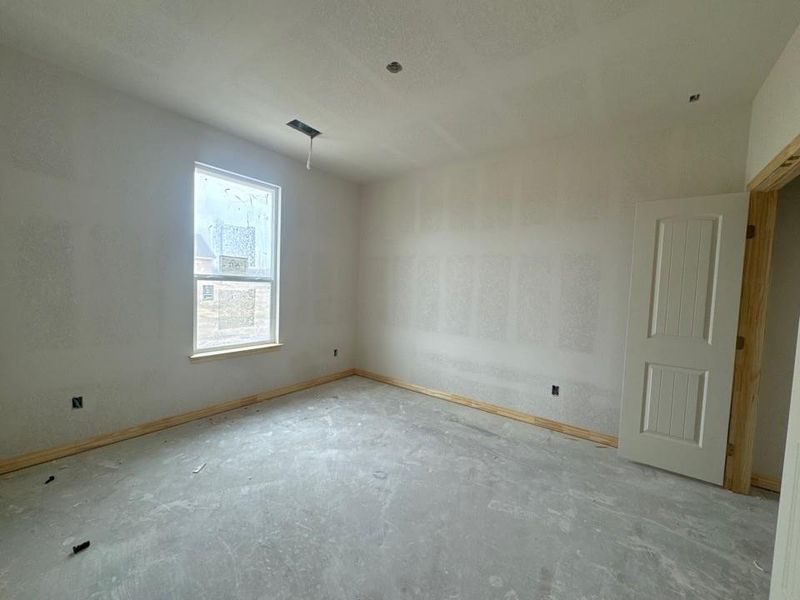 Spare room with baseboards and unfinished concrete floors Spare room with baseboards and unfinished concrete floors