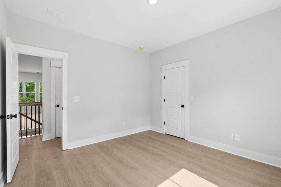 Spacious, unfurnished interior of a new home in Hidden Ponds Reserve, Awendaw (Image 19).