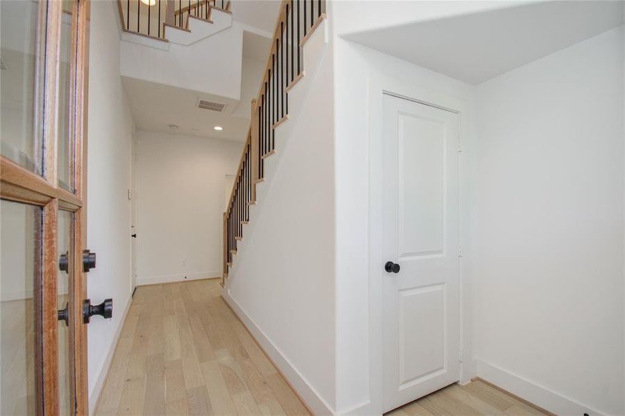 First floor entry with under the staircase storage closet. Entire home has engineered lvp flooring. Photos of similar completed home by same builder. Selections may differ.