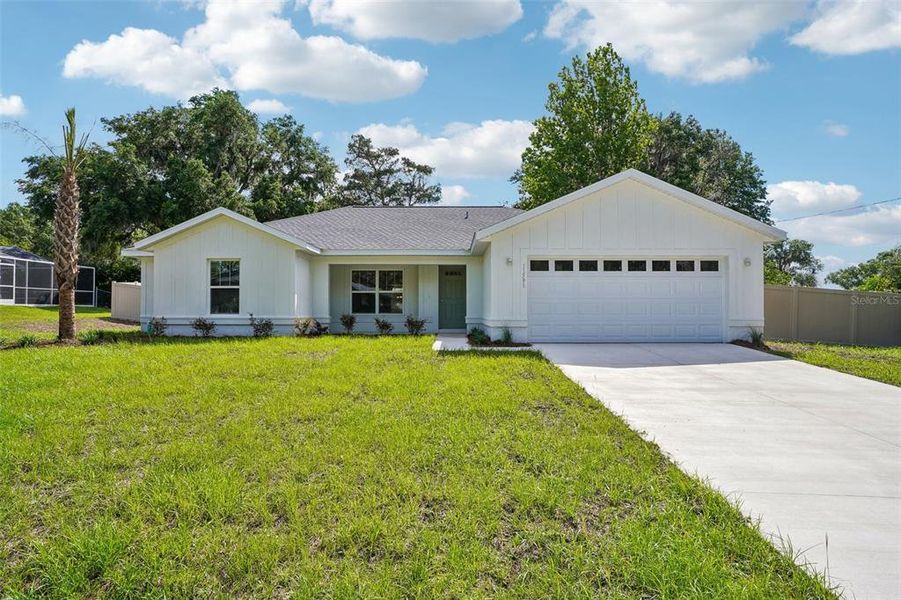 Front exterior of a new home in , Dunnellon, FL, highlighting curb appeal (Image 23).