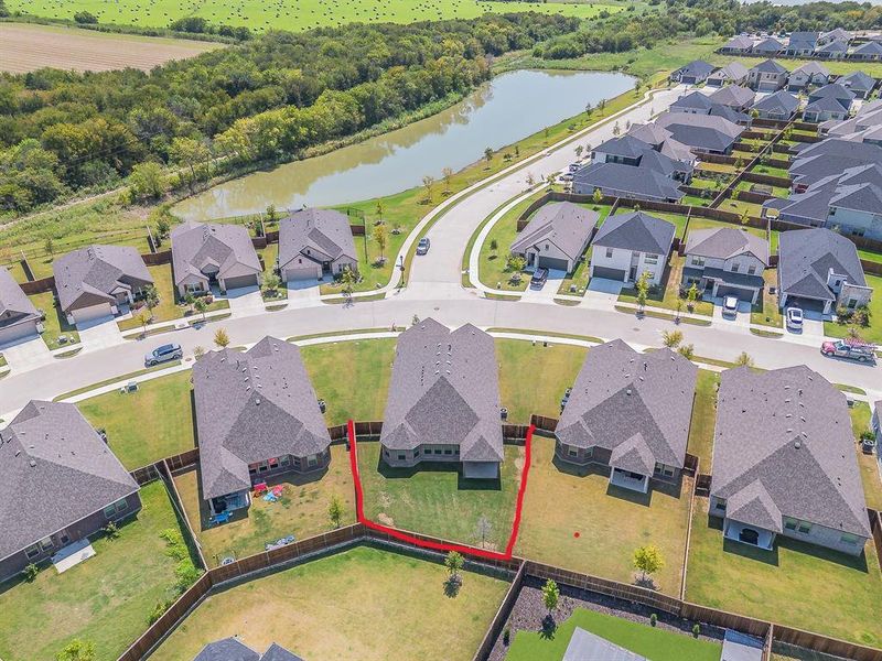 Aerial perspective of suburban area featuring a nearby body of water Aerial perspective of suburban area featuring a nearby body of water