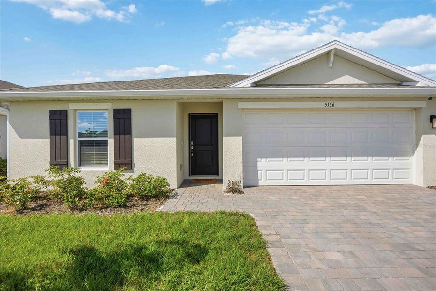 Front exterior of a new home in Central Parc, North Port, FL, highlighting curb appeal (Image 20).