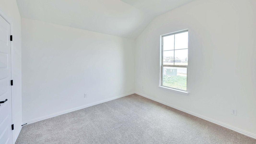 Representative furnished interior of a home built from the Palm by Brightland Homes in Sunterra, Katy (Image 14).