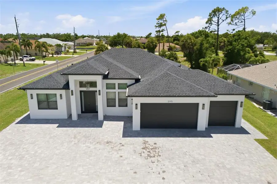 Front exterior of a new home in , Rotonda West, FL, highlighting curb appeal (Image 29). Front exterior of a new home in , Rotonda West, FL, highlighting curb appeal (Image 29).