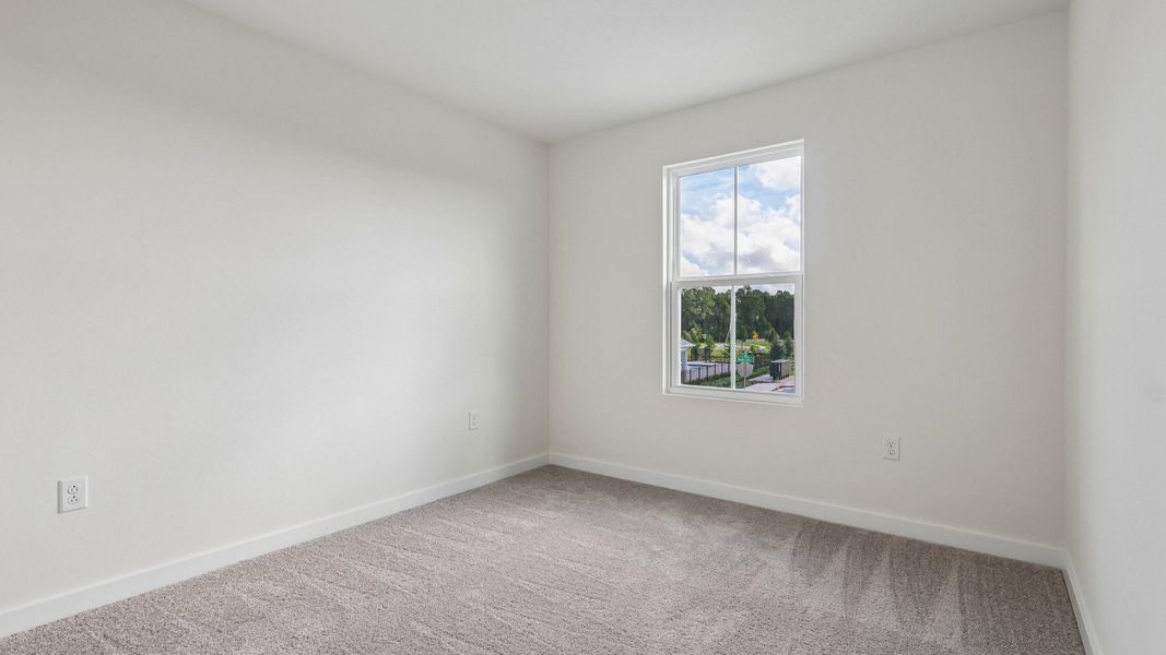 Furnished interior view inside a new home in Cyrene at Harmony, St. Cloud (Image 37).