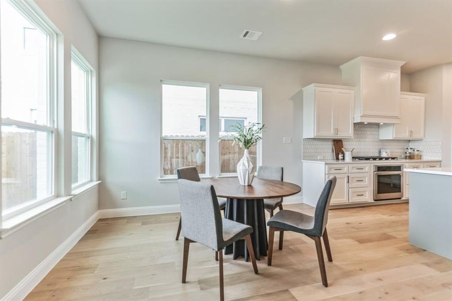 Dining space featuring light wood-type flooring