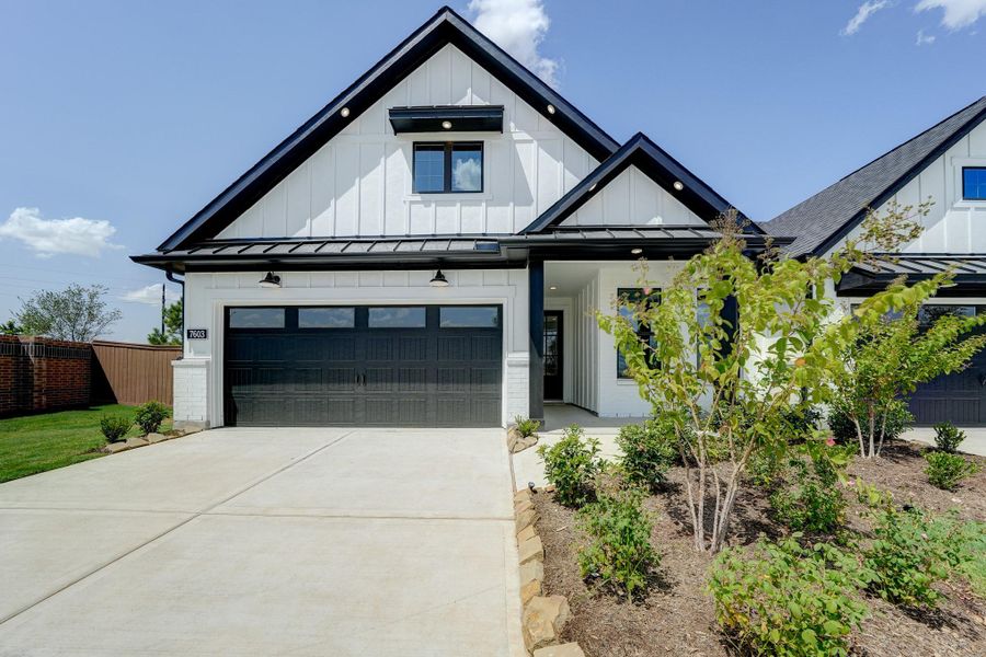 Front exterior of a new home in Bridgeland: Signature Collection, Cypress, TX, highlighting curb appeal (Image 20).