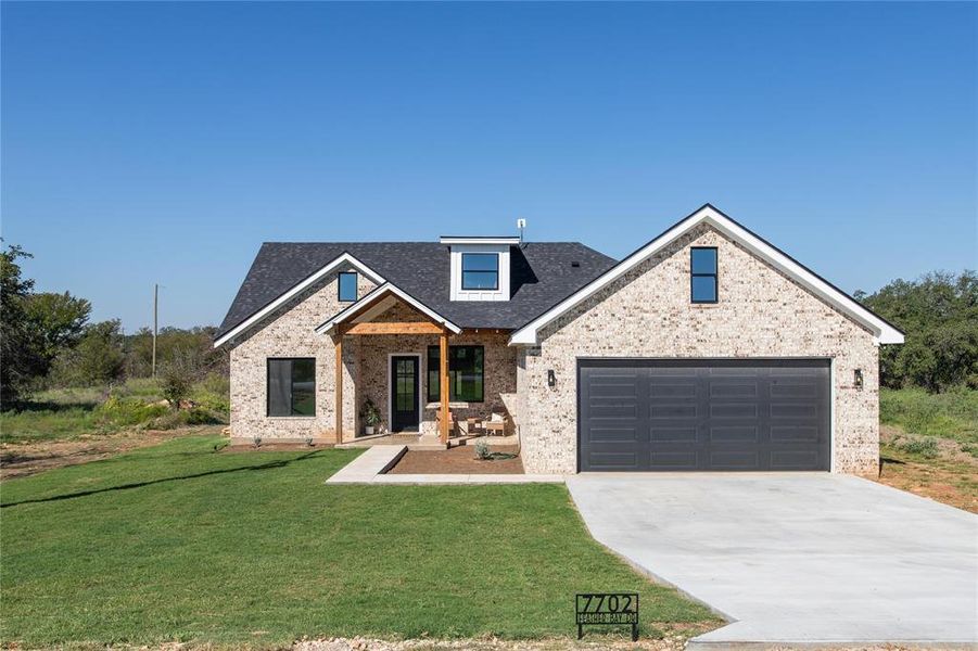 Front exterior of a new home in , Brownwood, TX, highlighting curb appeal (Image 21).