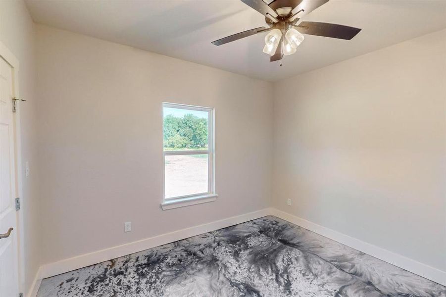 Spare room with ceiling fan