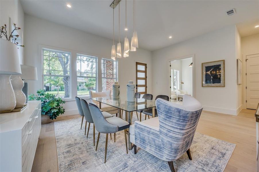 Dining space with light hardwood / wood-style flooring