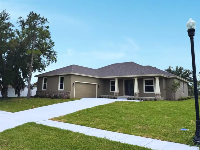 Front exterior of a new home in , Bartow, FL, highlighting curb appeal (Image 2). Front exterior of a new home in , Bartow, FL, highlighting curb appeal (Image 2).