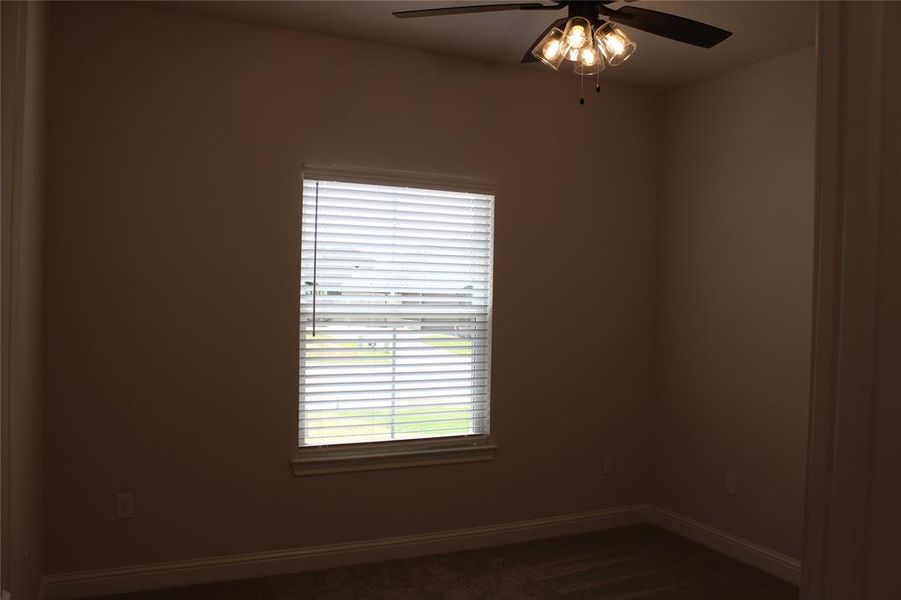 Unfurnished room featuring ceiling fan and baseboards Unfurnished room featuring ceiling fan and baseboards
