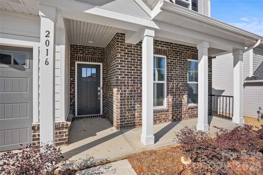 Exterior details and patio area of a home in Forest Creek, Waxhaw (Image 25).