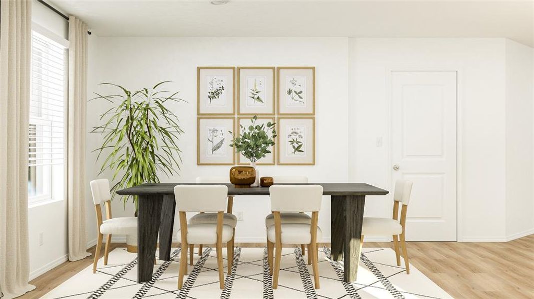 Dining space with light wood-style floors and healthy amount of natural light Dining space with light wood-style floors and healthy amount of natural light
