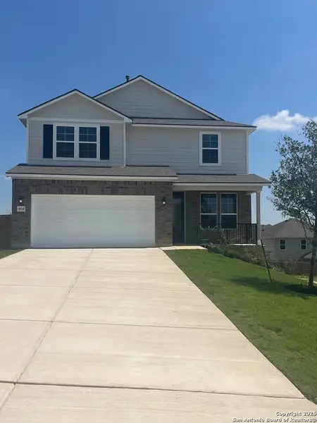 Front exterior of a new home in Weston Oaks, San Antonio, TX, highlighting curb appeal (Image 2). Front exterior of a new home in Weston Oaks, San Antonio, TX, highlighting curb appeal (Image 2).