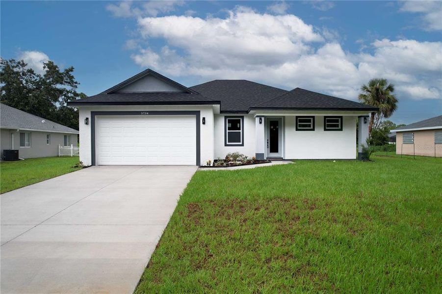 Front exterior of a new home in , North Port, FL, highlighting curb appeal (Image 28).