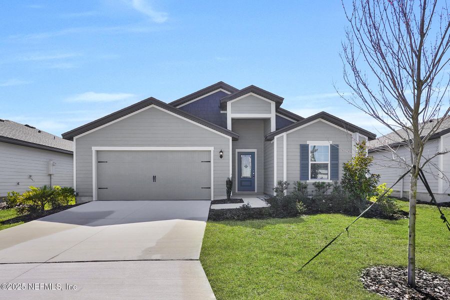 Front exterior of a new home in , Jacksonville, FL, highlighting curb appeal (Image 14).