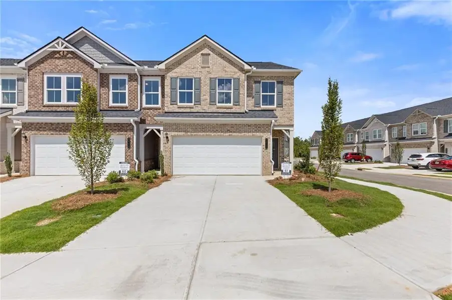 Front exterior of a new home in , Dacula, GA, highlighting curb appeal (Image 1).