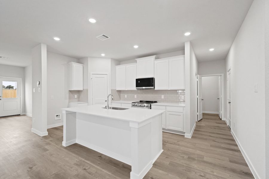 A kitchen with white cabinets. A kitchen with white cabinets.