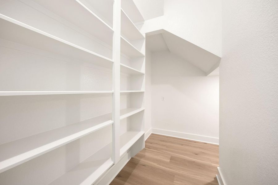 Abundant built-in shelving in the walk-in pantry provides ample storage space for all your kitchen essentials. Abundant built-in shelving in the walk-in pantry provides ample storage space for all your kitchen essentials.