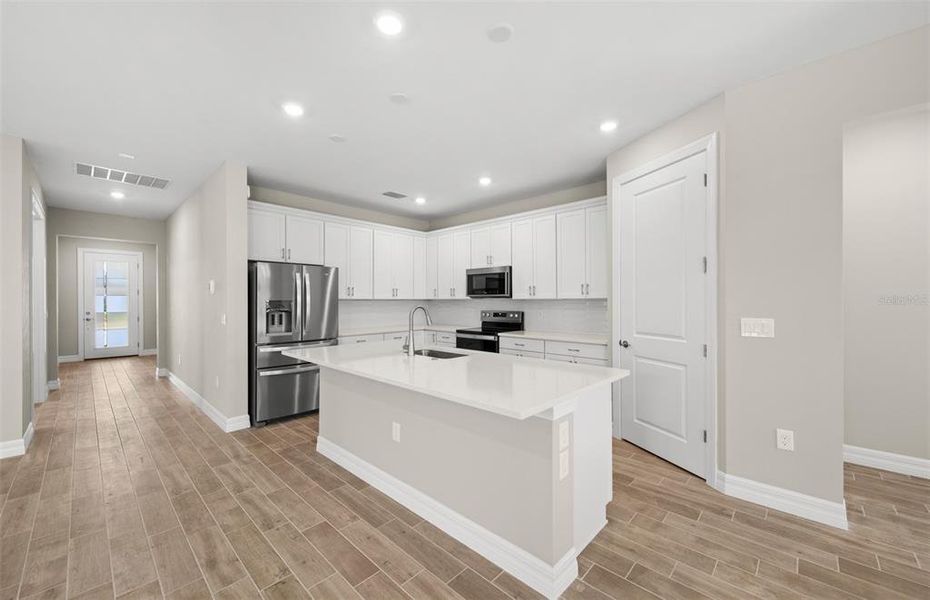 Furnished interior view inside a new home in Cedar Grove at The Woodlands, North Port (Image 12).