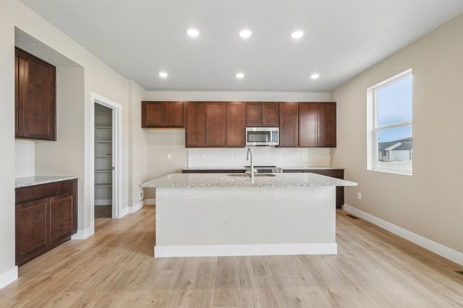 Furnished interior view inside a new home in The Trails at Aspen Ridge, Colorado Springs (Image 7).