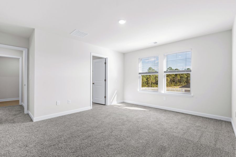 The primary suite leads to a well-appointed private bathroom. The primary suite leads to a well-appointed private bathroom.