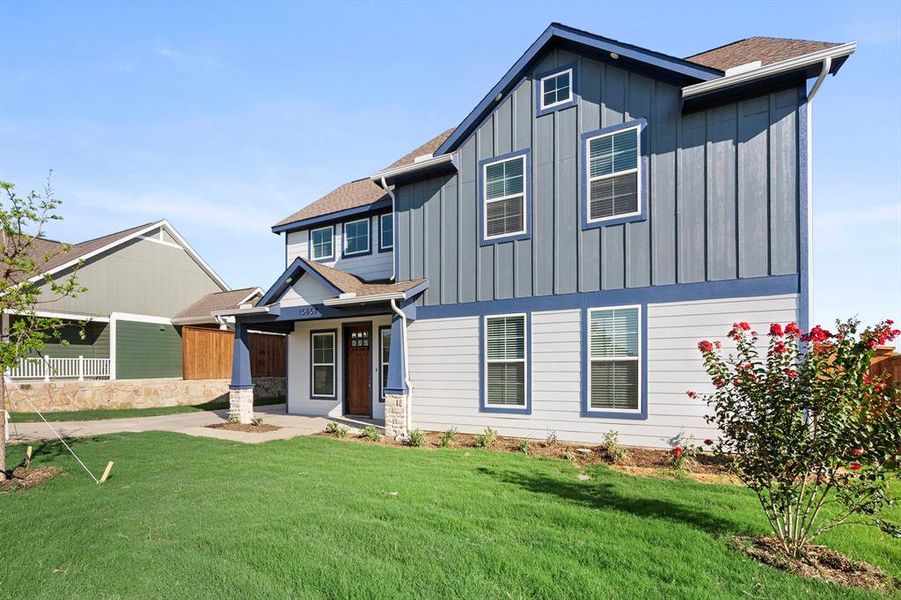 Front exterior of a new home in Heritage Towne, Grand Prairie, TX, highlighting curb appeal (Image 22).