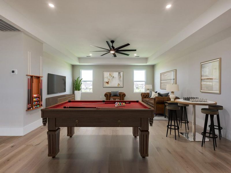 Virtual Staged Large upstairs game room with recessed lighting, ceiling fan, light wood-style flooring, and a raised ceiling