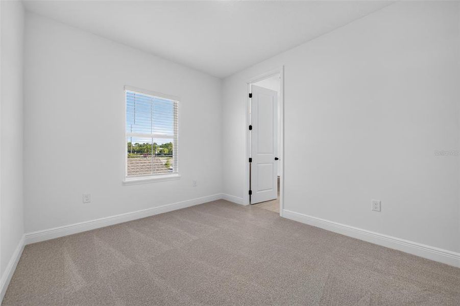 Spacious, unfurnished interior of a new home in Lake Cawood Cove, Windermere (Image 15).