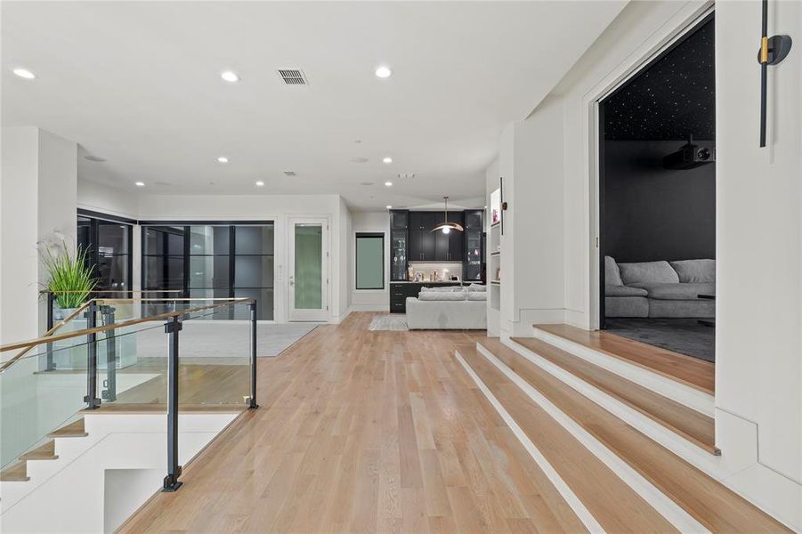 Hall featuring recessed lighting and light wood-style floors Hall featuring recessed lighting and light wood-style floors