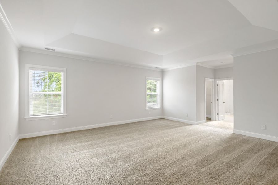Spacious, unfurnished interior of a new home in Tidewater at Lakes of Cane Bay, Summerville (Image 51).