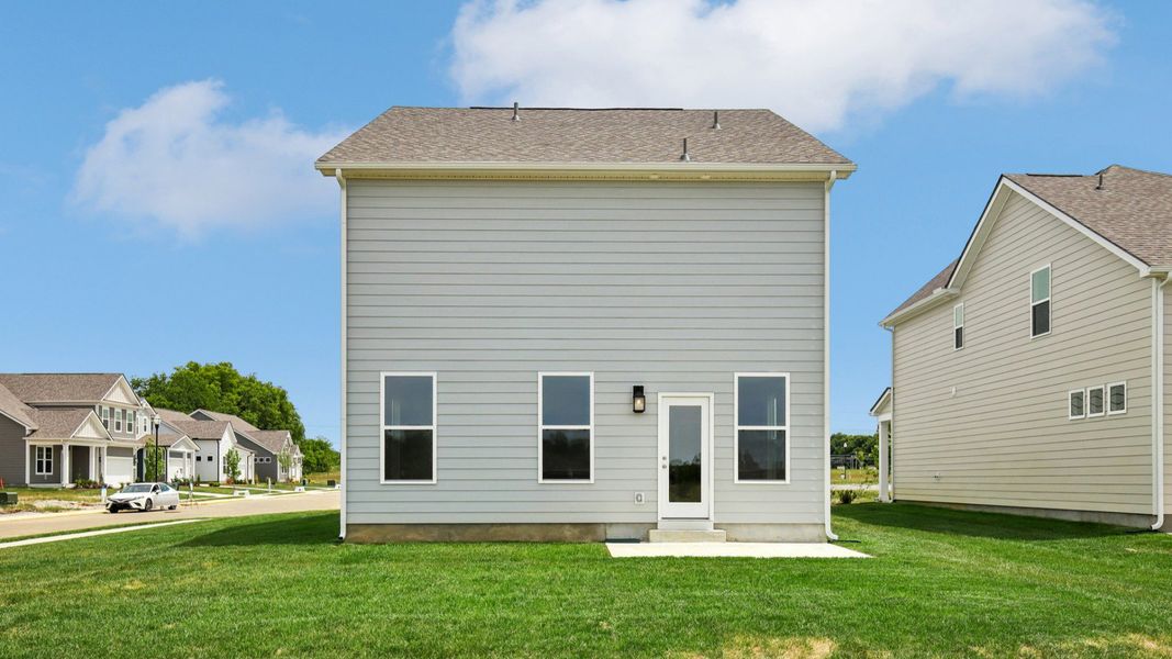 Backyard of home with small back patio Backyard of home with small back patio
