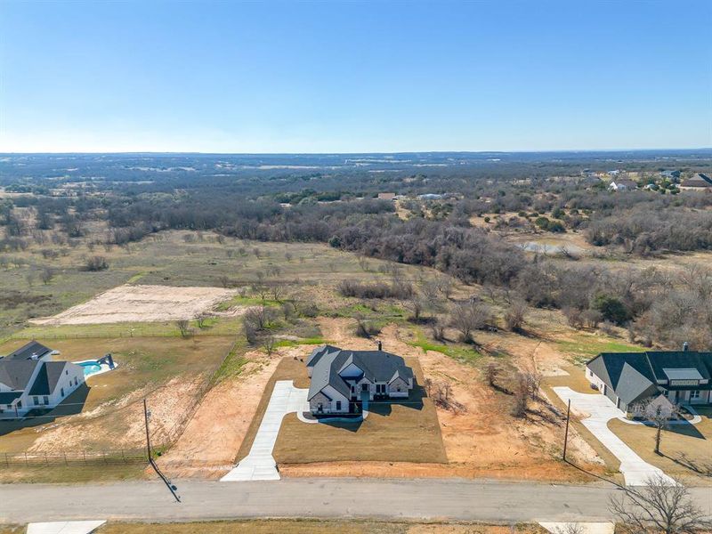 Front exterior of a new home in , Weatherford, TX, highlighting curb appeal (Image 27).