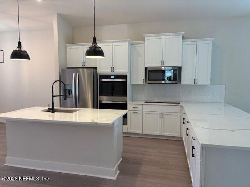 Furnished interior view inside a new home in Stables at Cary Forest, Bryceville (Image 6).