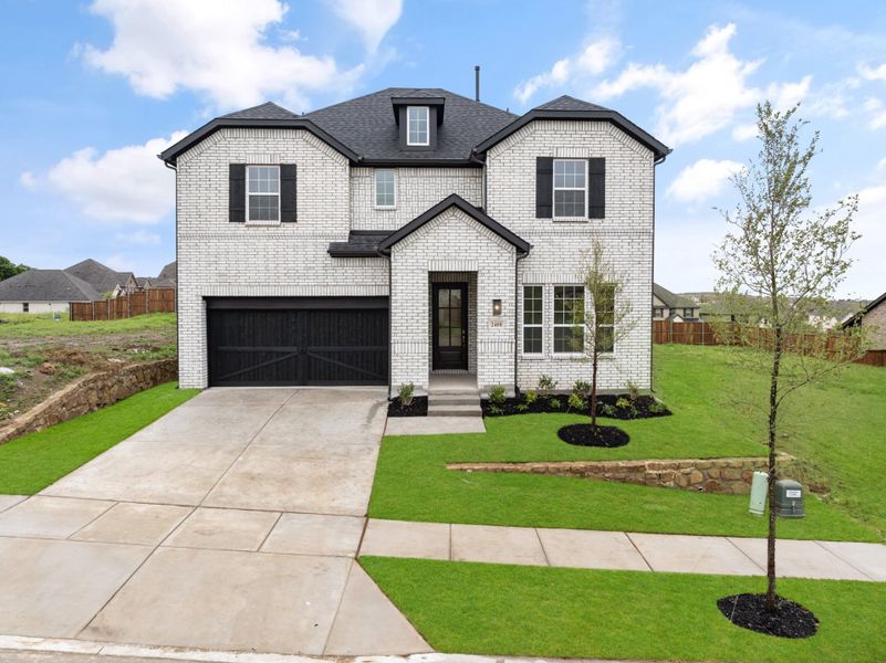 Front exterior of a new home in Legacy Hills, Celina, TX, highlighting curb appeal (Image 23).