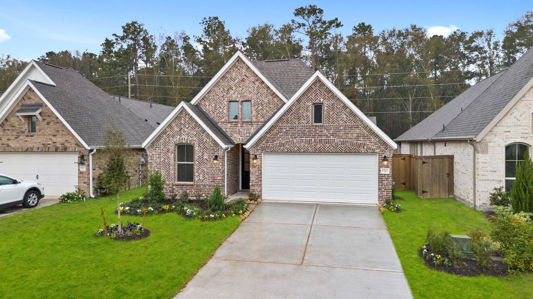 Front exterior of a new home in The Highlands 45', Porter, TX, highlighting curb appeal (Image 23).
