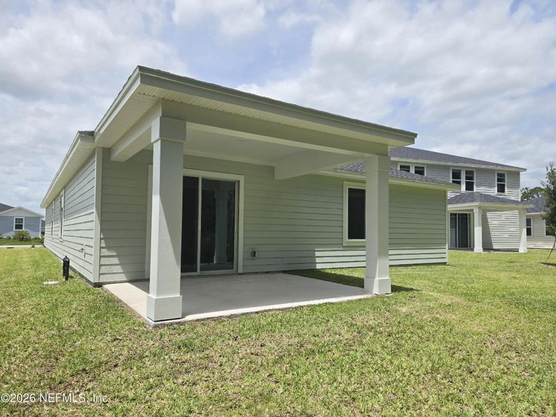 Exterior details and patio area of a home in Flagler Village - Signature Series, Palm Coast (Image 18).