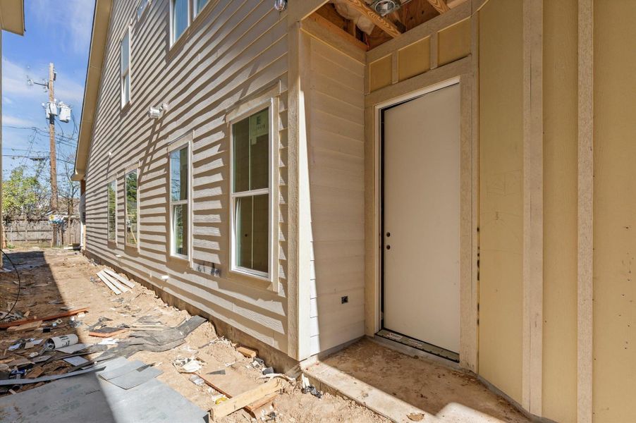 Side view of home with view of the front door.
